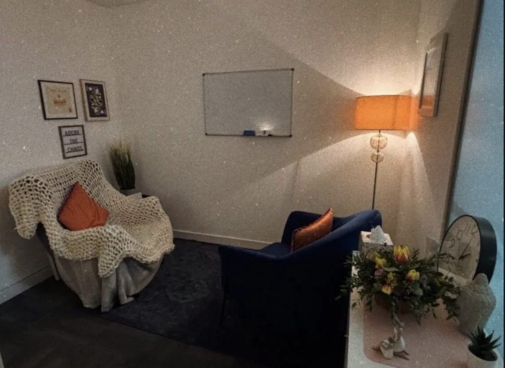 Psychodynamic therapy space in Glasgow city centre. It has low lighting and looks cosy and safe.